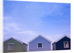 Beach huts in a row against sky by Assaf Frank